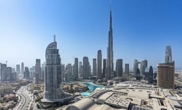 A panoramic view of a city with tall buildings