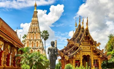 standing statue and temples landmark during daytime