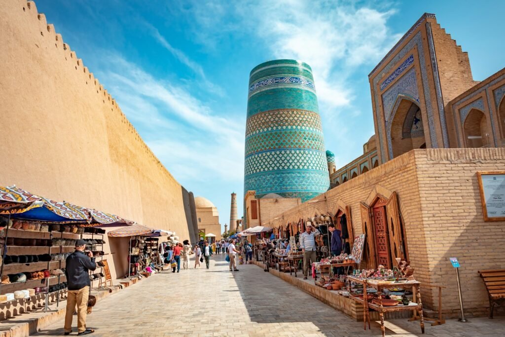 A narrow street with a tall building in the background