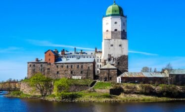 Medieval castle with green dome on a bright sunny day