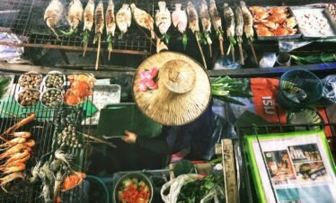 person wearing Asian conical hat