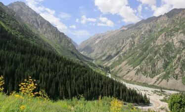 A scenic view of a mountain valley with a river running through it